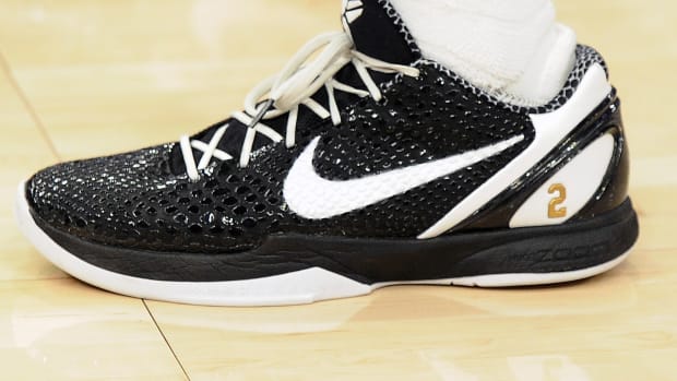 Black and white Nike Kobe shoes.